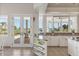 Bright kitchen with water views and access to a patio at 17601 Sawgrass Run, Tavares, FL 32778