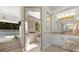 Spa-like bathroom with soaking tub, walk-in shower, and dual vanities at 17601 Sawgrass Run, Tavares, FL 32778