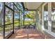 Relaxing screened porch overlooking tranquil water views at 17601 Sawgrass Run, Tavares, FL 32778