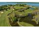 Aerial view of golf course with water features at 17601 Sawgrass Run, Tavares, FL 32778
