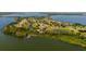 Wide view of the golf course community and lake at 17601 Sawgrass Run, Tavares, FL 32778