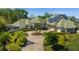 Luxury home with solar panels and circular driveway at 17601 Sawgrass Run, Tavares, FL 32778