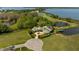 Luxury home on the lake with circular driveway at 17601 Sawgrass Run, Tavares, FL 32778