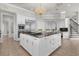 Gourmet kitchen with island, stainless steel appliances, and granite countertops at 17601 Sawgrass Run, Tavares, FL 32778