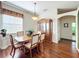 Bright dining room featuring a wood table, chairs, and hutch at 25611 Maurepas Ln, Leesburg, FL 34748