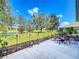 Spacious patio with seating area and pond view at 25611 Maurepas Ln, Leesburg, FL 34748