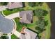 Aerial view of home situated on a quiet residential street at 25611 Maurepas Ln, Leesburg, FL 34748