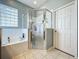 Walk-in shower with built-in seat in a spacious bathroom at 25611 Maurepas Ln, Leesburg, FL 34748