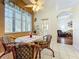 Cozy breakfast nook with round table and wicker chairs at 25611 Maurepas Ln, Leesburg, FL 34748