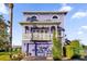 Purple two-story house with white balcony and double garage at 305 Shadow Harbour Ln # 305, Mount Dora, FL 32757