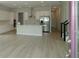 Modern kitchen with white cabinets, island, and stainless steel appliances at 9934 Fiddley Aly, Orlando, FL 32827