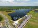 Aerial view of a lake with a cable park and inflatable water park at 9934 Fiddley Aly, Orlando, FL 32827