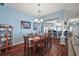 Formal dining room with hardwood floors and a view to the kitchen at 8090 Se 171St Mcalpin St, The Villages, FL 32162