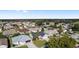Aerial view of neighborhood featuring houses, landscaping, and palm trees at 1312 Landeros Ln, The Villages, FL 32159