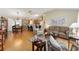 Open concept living room with hardwood floors, neutral decor, and ample natural light at 1312 Landeros Ln, The Villages, FL 32159
