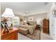 Main bedroom with king-size bed and plush bedding at 1312 Landeros Ln, The Villages, FL 32159