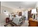 Guest bedroom with a full-size bed and an ornate metal frame at 1312 Landeros Ln, The Villages, FL 32159