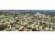 Aerial view of residential neighborhood near golf course and resort at 1312 Landeros Ln, The Villages, FL 32159