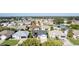 Aerial view of houses in a residential neighborhood with green lawns and landscaping at 1312 Landeros Ln, The Villages, FL 32159