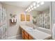 Bathroom with single sink vanity and shower at 1312 Landeros Ln, The Villages, FL 32159