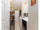 Laundry room with washer, dryer, and storage shelving at 1312 Landeros Ln, The Villages, FL 32159