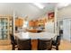 Well-equipped kitchen featuring wood cabinets, a large island, and stainless steel appliances at 1312 Landeros Ln, The Villages, FL 32159
