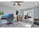 Home office with a gaming setup and view into living room at 2030 Leisure Dr, Winter Haven, FL 33881