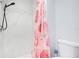 Clean bathroom with a shower/tub combo and a strawberry patterned shower curtain at 2030 Leisure Dr, Winter Haven, FL 33881