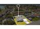Aerial view of single-Gathering home with a carport and solar panels at 2030 Leisure Dr, Winter Haven, FL 33881