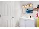Small bathroom with white vanity and a rectangular mirror at 2030 Leisure Dr, Winter Haven, FL 33881