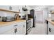 Modern kitchen with white shaker cabinets, butcher block countertops, and stainless steel appliances at 2030 Leisure Dr, Winter Haven, FL 33881