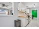Modern kitchen with white shaker cabinets, butcher block countertops, and stainless steel appliances at 2030 Leisure Dr, Winter Haven, FL 33881