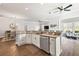 Open concept kitchen with island, stainless steel appliances, and granite counters at 17257 Se 113Th Ave, Summerfield, FL 34491