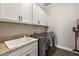 Bright laundry room with washer, dryer, and utility sink at 17257 Se 113Th Ave, Summerfield, FL 34491