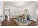 Elegant dining room with a wood table and chandelier at 17257 Se 113Th Ave, Summerfield, FL 34491