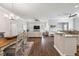 Open floor plan with dining area, living room, and kitchen at 17257 Se 113Th Ave, Summerfield, FL 34491