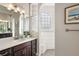 Spa-like bathroom with walk-in shower and double vanity at 17257 Se 113Th Ave, Summerfield, FL 34491