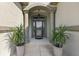 Welcoming front entrance with columns and potted plants at 17257 Se 113Th Ave, Summerfield, FL 34491