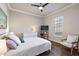 Spacious bedroom with a cozy sitting area and ample natural light at 17257 Se 113Th Ave, Summerfield, FL 34491