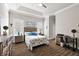 Spacious bedroom with a dresser and en-suite bathroom at 17257 Se 113Th Ave, Summerfield, FL 34491