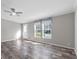 Spacious living room with wood-look vinyl flooring and ceiling fan at 18451 14Th Ave, Orlando, FL 32833