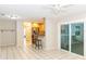 Dining area with tile floors and view into kitchen at 1233 Overlook Rd, Eustis, FL 32726