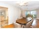 Bright dining room with wood flooring and a view of the kitchen at 1233 Overlook Rd, Eustis, FL 32726