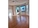 Spacious living room featuring hardwood floors and large windows at 3425 Dixon Ln, The Villages, FL 32162