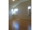 Bright bedroom with hardwood floors and multiple windows at 3425 Dixon Ln, The Villages, FL 32162