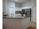 Kitchen boasts granite countertops and modern appliances at 3425 Dixon Ln, The Villages, FL 32162