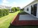 Private backyard with patio and landscaping at 3425 Dixon Ln, The Villages, FL 32162