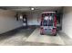 Spacious garage with golf cart and extra storage space at 3425 Dixon Ln, The Villages, FL 32162