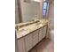 Double vanity bathroom with granite countertop at 3425 Dixon Ln, The Villages, FL 32162
