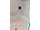 Walk-in shower with tiled walls and seat at 3425 Dixon Ln, The Villages, FL 32162